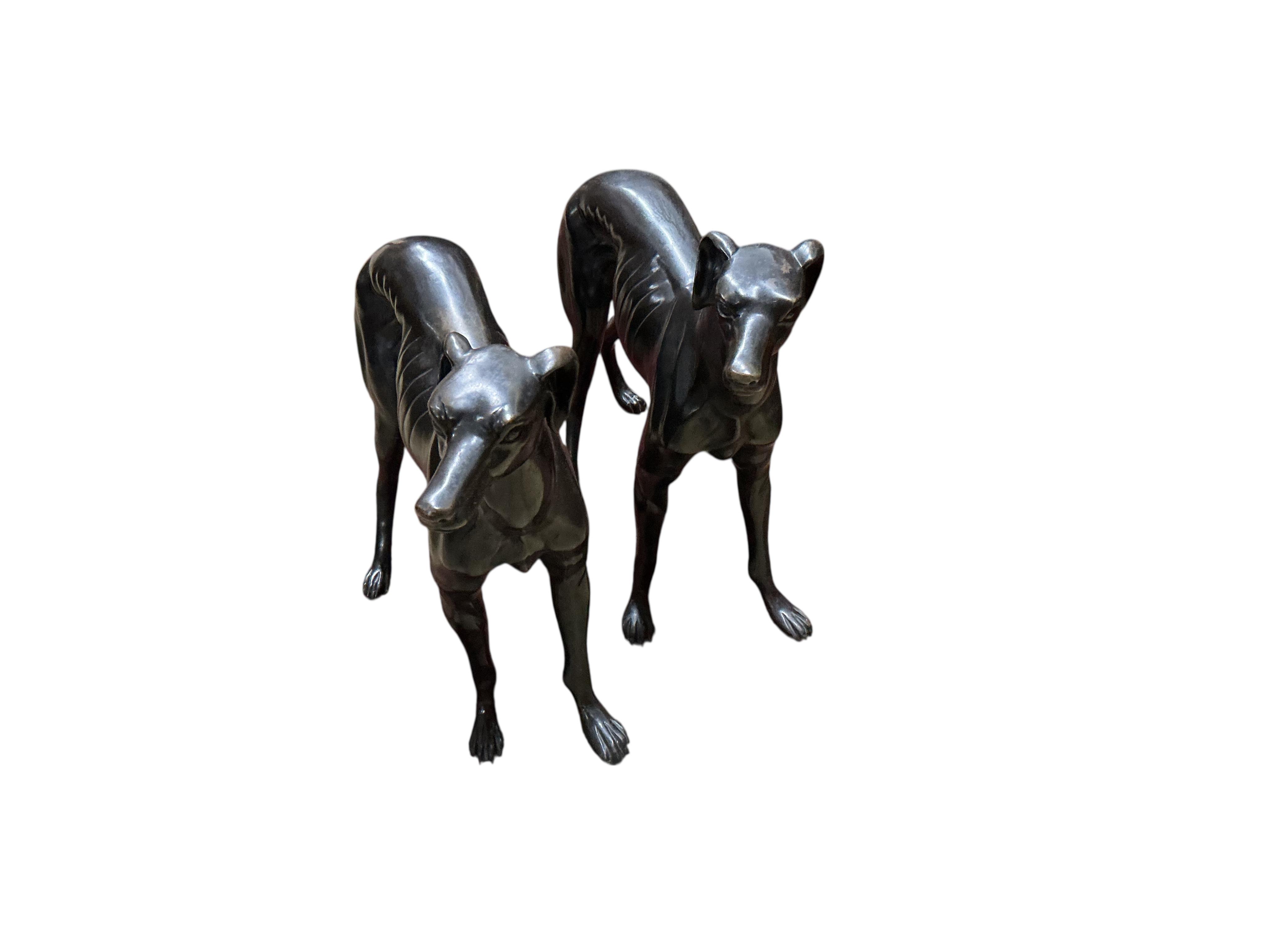 A pair of modern bronze models of greyhounds, length 70cm, height 51cm